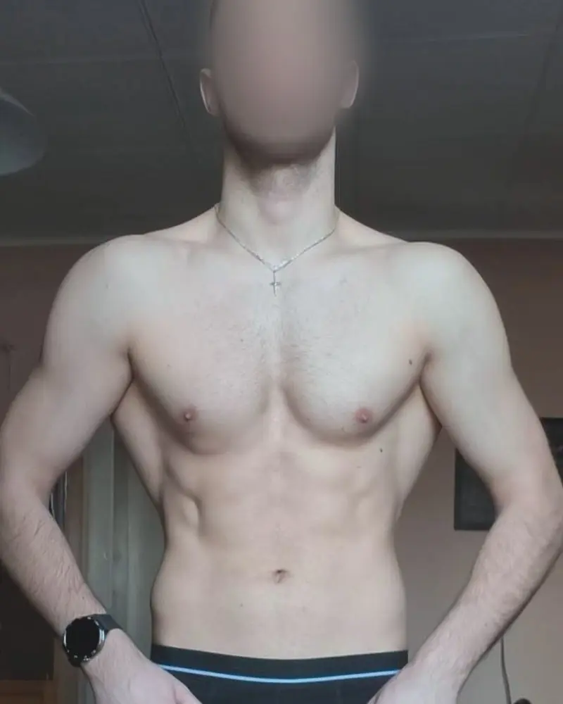 Aleks at the start: standing front on at home, face blurred.